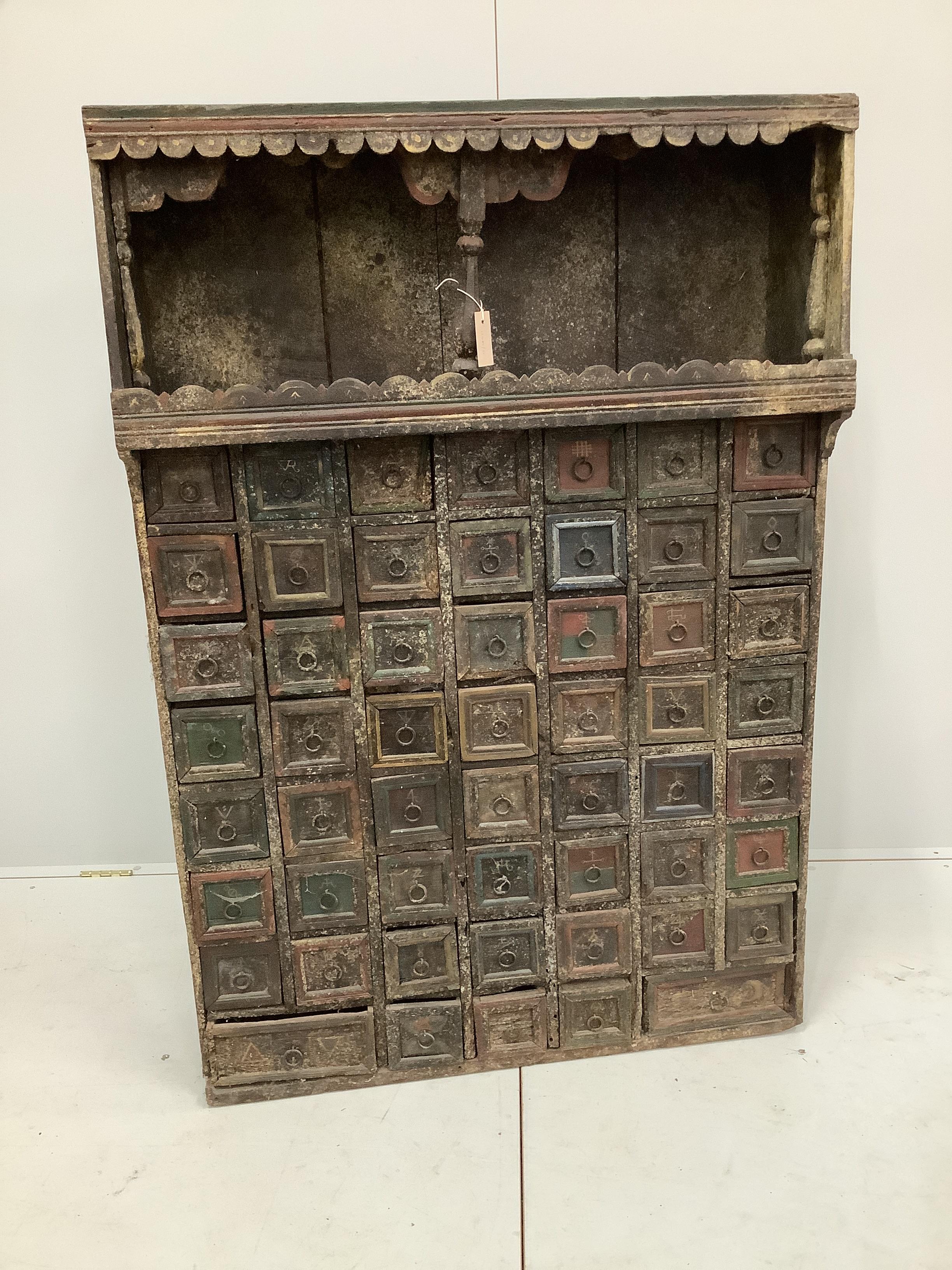 An Indian painted hardwood bank of drawers (af), width 96cm, depth 31cm, height 141cm